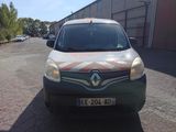 a small van that is parked in a parking lot