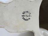 a white vase with black writing on it