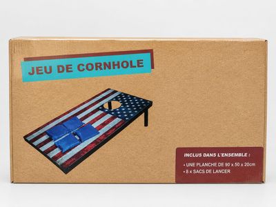 boîte en carton sur laquelle figure l'image d'une table surmontée d'un drapeau