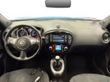 the interior of a small car with a dashboard and steering controls