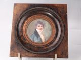 painting of a woman in a blue dress in a wooden frame