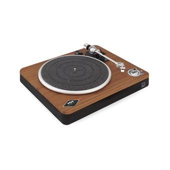 gros plan d'une table tournante sur laquelle se trouve un tourne-disque