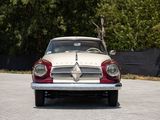 a red and white car that is parked in a parking lot