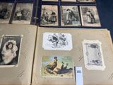 a lot of old photos on display on a table