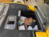a car that has a bunch of items in the trunk of it