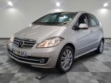 a picture of a silver mercedes b - class parked in a garage