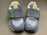 a pair of new balance shoes on a table