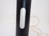 an image of a black and white vase with a cord