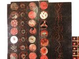 two panels with different designs on them on a table