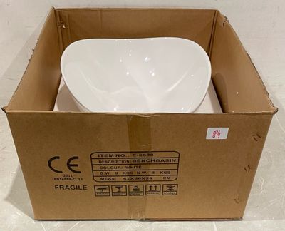 une boîte en carton contenant un bol blanc