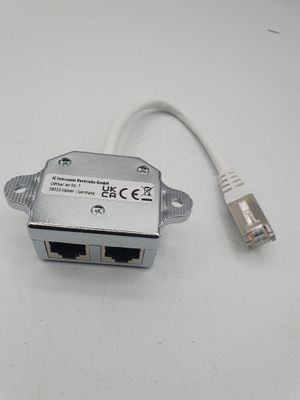 a white cable that is connected to a small device