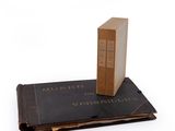 a book with a box on top of it on top of a book
