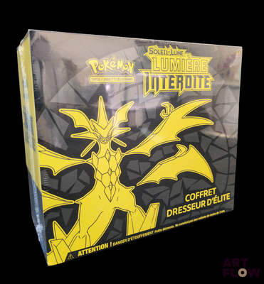 the box is full of a yellow and black pokemon card game