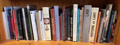 many books that are on a shelf in a book case