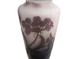 a vase that has a picture of a tree on it