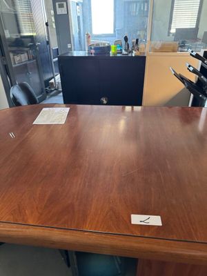 an image of a wooden conference table in an office