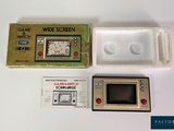 a game and a watch sitting next to each other on a table