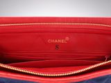the inside of a red and blue chanel purse