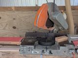 a picture of a workbench with a mitre saw on it