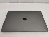an apple macbook pro laptop sitting on top of a white table