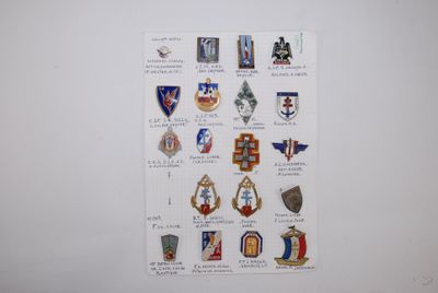 a picture of a wall with a bunch of badges on it