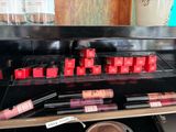 a display of lipsticks and other cosmetics items in a store