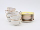 a lot of cups and saucers stacked on top of each other