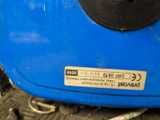 a close up of a blue suitcase with a sticker on it