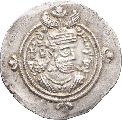 a close up of a coin with a crown on it