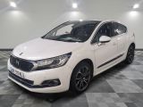 the white car is parked on a checkered floor in a room