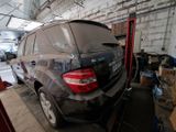 a black car that is parked in a garage