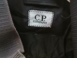 a close up of a black jacket with a white label on it