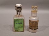 two bottles of medicine sitting next to each other on a table