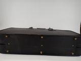 a black suitcase that is sitting on a table