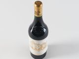a bottle of wine that is sitting on a table