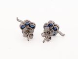 pair of silver and blue stone earrings on white background