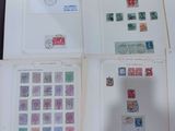 a lot of stamps on a table with a lot of them