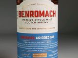 a bottle of benromach whisky sitting on a table