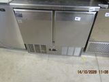 two stainless steel refrigerators on display in a store