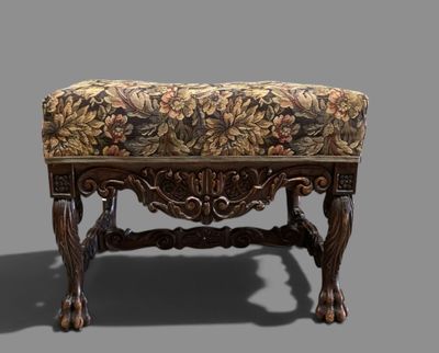 a bench with a floral upholstered seat on it