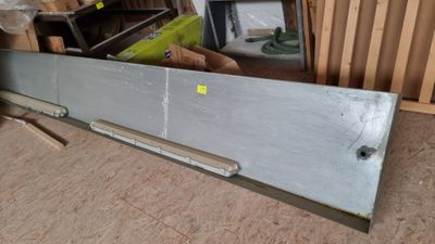 a picture of a metal door in the middle of a room