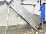 a picture of a conveyor belt in a garage