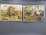 trois tableaux suspendus à une corde à linge fixée au mur