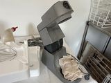 a table with a bunch of dishes and a mixer on it