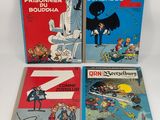three comics books on a white background