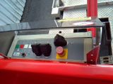 an image of a gas station with a red car