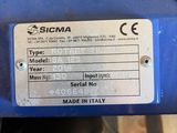 a label on the side of a blue machine