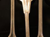five spoons and two spoon spoons on a table