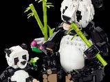 a lego panda and a panda bear sitting next to each other
