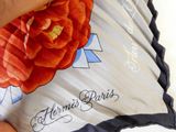 a person that is holding a pillow with a flower on it